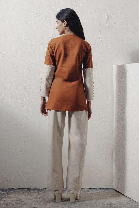 Shop Veera Wear Ivory Denim Split V-neck Lace-up Rivet Detail Top at Aza Fashions Shop_Veera Wear_Ivory Denim Split V-neck Lace-up Rivet Detail Top _at_Aza_Fashions