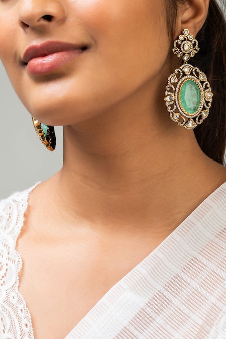 Shop Zevar King Green Stones Antique Gold Plated Flower Earrings at Aza Fashions Shop_Zevar King_Green Stones Antique Gold Plated Flower Earrings _at_Aza_Fashions