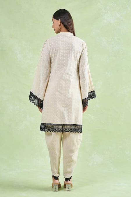 Shop Naintara Bajaj Beige Cotton Embroidery, Lace Mandarin Collar Floral Schiffli Kurta And Dhoti Set at Aza Fashions Shop_Naintara Bajaj_Beige Cotton Embroidery, Lace Mandarin Collar Floral Schiffli Kurta And Dhoti Set _at_Aza_Fashions