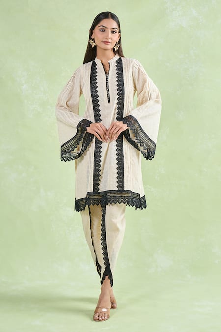 Shop Naintara Bajaj Beige Cotton Embroidery, Lace Mandarin Collar Floral Schiffli Kurta And Dhoti Set Online at Aza Fashions Shop_Naintara Bajaj_Beige Cotton Embroidery, Lace Mandarin Collar Floral Schiffli Kurta And Dhoti Set _Online_at_Aza_Fashions