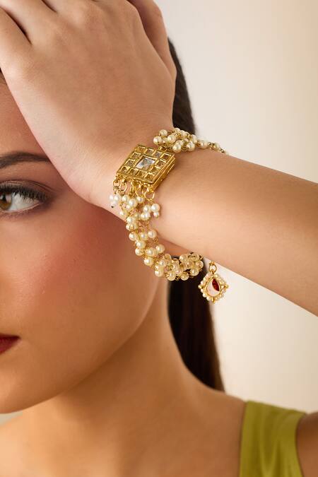 Buy Just Shradhas Gold Plated Pearls, Crystals Kundan And Embellished Bracelet Online at Aza Fashions Buy_Just Shradhas_Gold Plated Pearls, Crystals Kundan And Embellished Bracelet _Online_at_Aza_Fashions