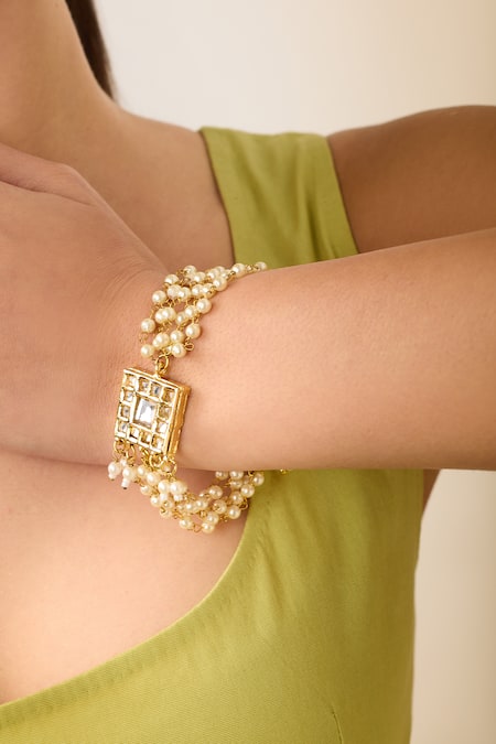 Shop Just Shradhas Gold Plated Pearls, Crystals Kundan And Embellished Bracelet Online at Aza Fashions Shop_Just Shradhas_Gold Plated Pearls, Crystals Kundan And Embellished Bracelet _Online_at_Aza_Fashions