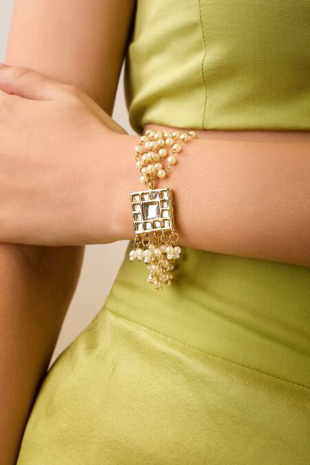 Just Shradhas Gold Plated Pearls, Crystals Kundan And Embellished Bracelet at Aza Fashions Just Shradhas_Gold Plated Pearls, Crystals Kundan And Embellished Bracelet _at_Aza_Fashions