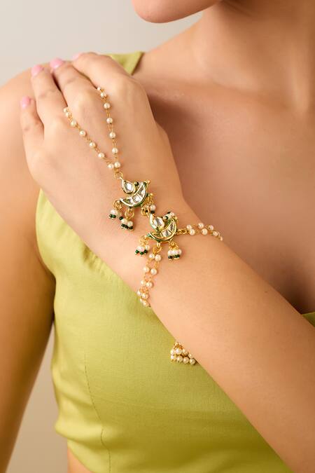 Just Shradhas Gold Plated Natural Stone And Pearl Haathphool at Aza Fashions Just Shradhas_Gold Plated Natural Stone And Pearl Haathphool _at_Aza_Fashions