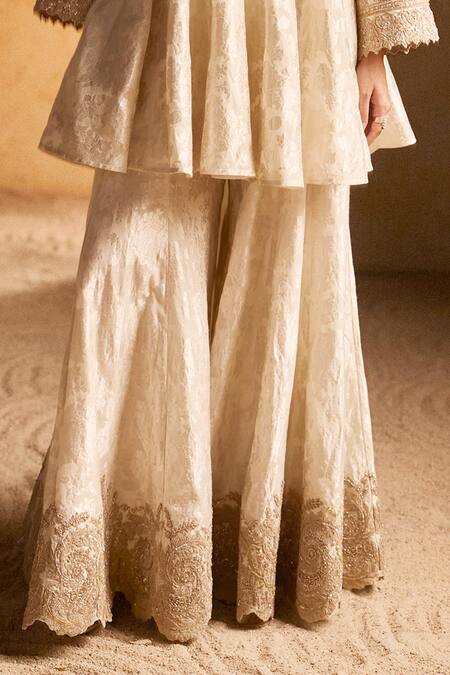 Pankaj & Nidhi_Ivory Brocade Pearls, Embroidery Split V-neck Floral Woven Peplum Kurta Set _Online_at_Aza_Fashions