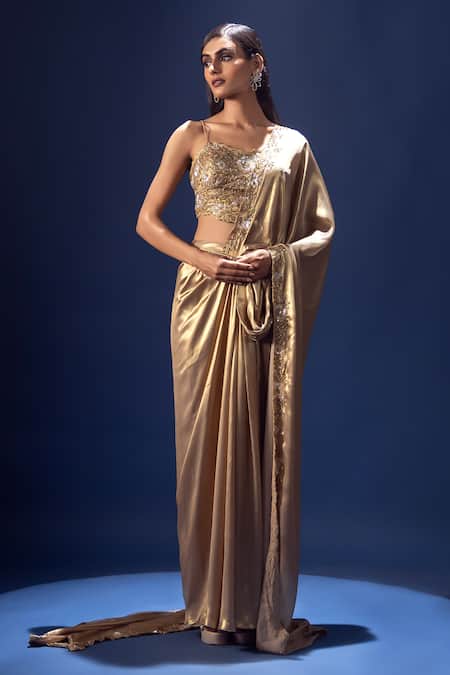 Shop Krisha Sunny Ramani Gold Satin, Georgette Cut Work, Beads, Embroidered Pre-draped Saree And Blouse at Aza Fashions Shop_Krisha Sunny Ramani_Gold Satin, Georgette Cut Work, Beads, Embroidered Pre-draped Saree And Blouse _at_Aza_Fashions