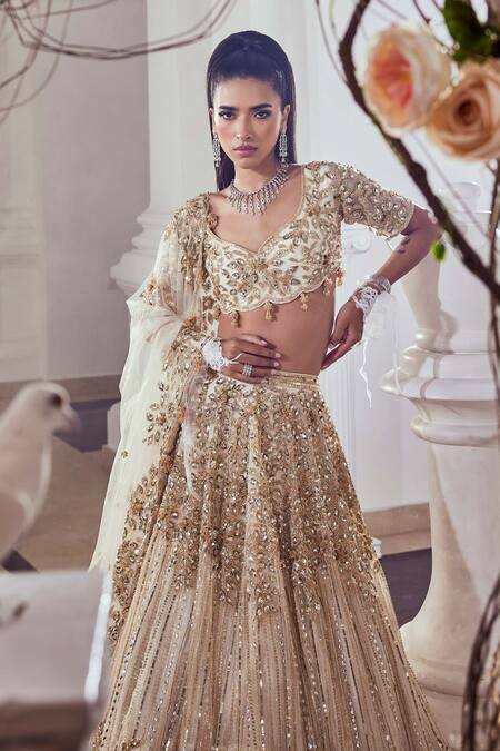 Swish By Dolcy And Simran_Ivory Net Cut Work, Sequins Sweetheart Neck Embroidered Bridal Lehenga Set _Online_at_Aza_Fashions