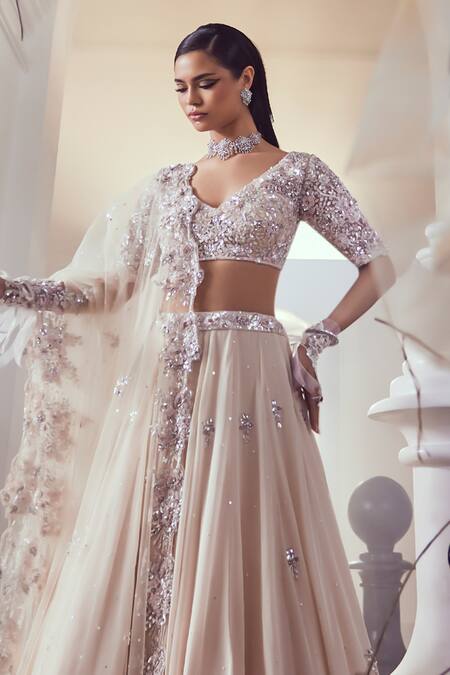 Swish By Dolcy And Simran_Peach Net, Crepe Sequins, Cut Work V-neck Petal Bloom Embroidered Lehenga Set _Online_at_Aza_Fashions
