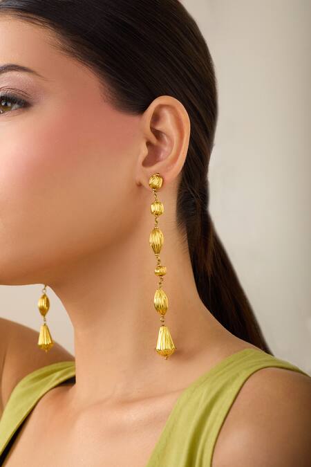 Just Shradhas_Gold Plated Carved Long Earrings _at_Aza_Fashions