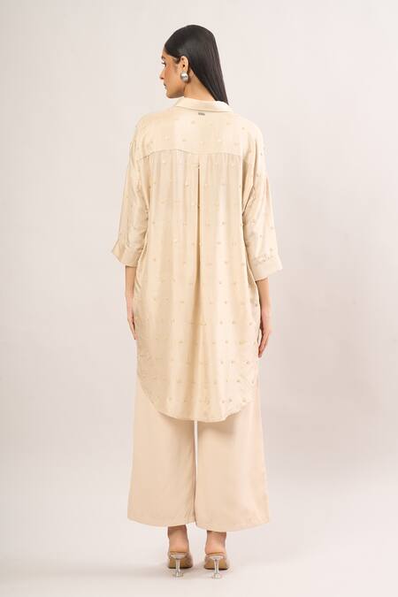 Shop Shweta Kapoor Cream Silk Sequins Collared Asymmetrical Embroidered Shirt Tunic at Aza Fashions Shop_Shweta Kapoor_Cream Silk Sequins Collared Asymmetrical Embroidered Shirt Tunic_at_Aza_Fashions
