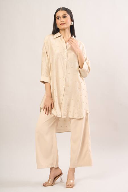 Shop Shweta Kapoor Cream Silk Sequins Collared Asymmetrical Embroidered Shirt Tunic Online at Aza Fashions Shop_Shweta Kapoor_Cream Silk Sequins Collared Asymmetrical Embroidered Shirt Tunic_Online_at_Aza_Fashions