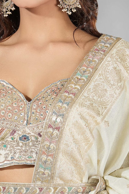 Shop Samyukta Singhania Beige Crepe, Silk Sequins, Zari Sweetheart Neck Embroidered And Lehenga Set Online at Aza Fashions Shop_Samyukta Singhania_Beige Crepe, Silk Sequins, Zari Sweetheart Neck Embroidered And Lehenga Set _Online_at_Aza_Fashions