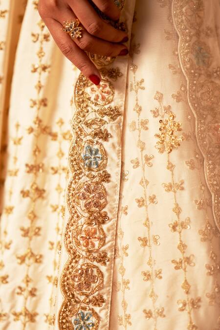 Angad Singh Ivory Silk, Crepe Embroidery, Sequins Asymmetric Lehenga Set With Dupattas at Aza Fashions Angad Singh_Ivory Silk, Crepe Embroidery, Sequins Asymmetric Lehenga Set With Dupattas _at_Aza_Fashions