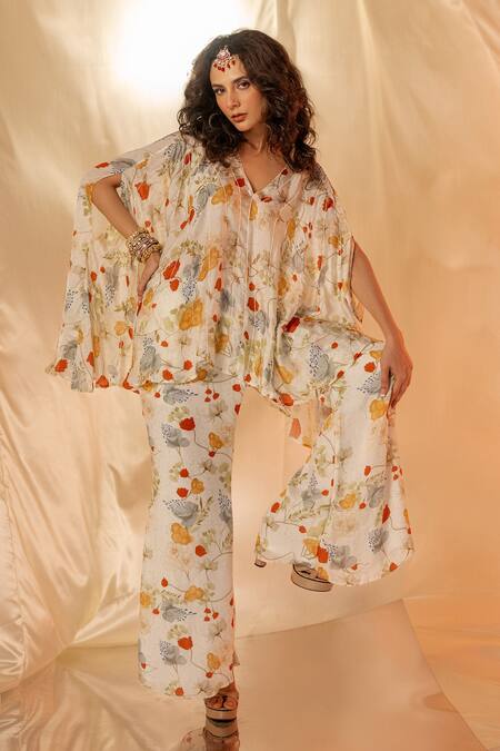 Label Shristi Chetani White Satin Floral Printed Cape Top And Flare Pants Set Online at Aza Fashions Label Shristi Chetani_White Satin Floral Printed Cape Top And Flare Pants Set_Online_at_Aza_Fashions