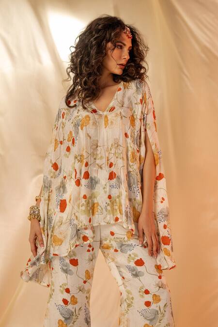 Label Shristi Chetani White Satin Floral Printed Cape Top And Flare Pants Set at Aza Fashions Label Shristi Chetani_White Satin Floral Printed Cape Top And Flare Pants Set_at_Aza_Fashions