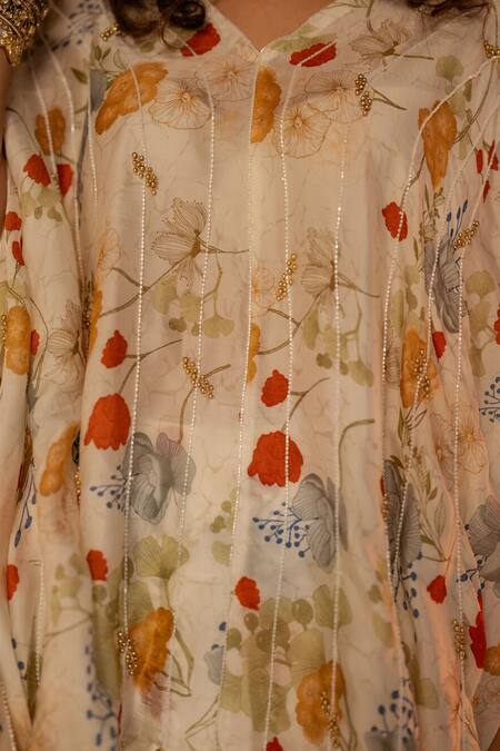 Buy Label Shristi Chetani White Satin Floral Printed Cape Top And Flare Pants Set Buy_Label Shristi Chetani_White Satin Floral Printed Cape Top And Flare Pants Set