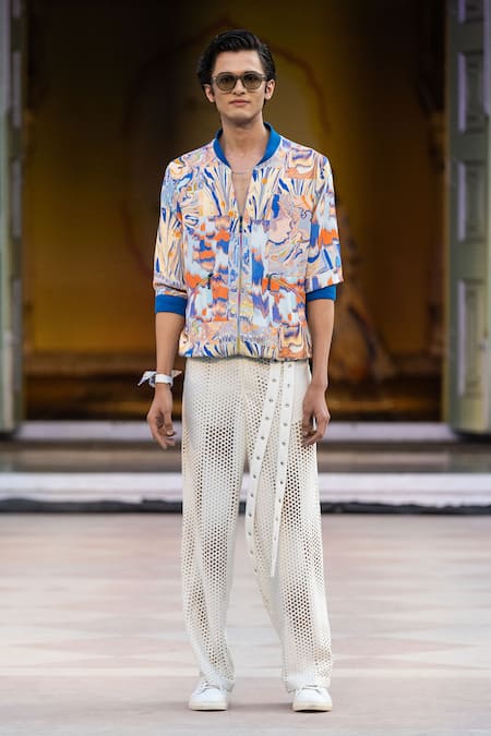 Shop Mandira Wirk Resort Ivory Faux Leather Laser Cut Casual Trousers at Aza Fashions Shop_Mandira Wirk Resort_Ivory Faux Leather Laser Cut Casual Trousers _at_Aza_Fashions