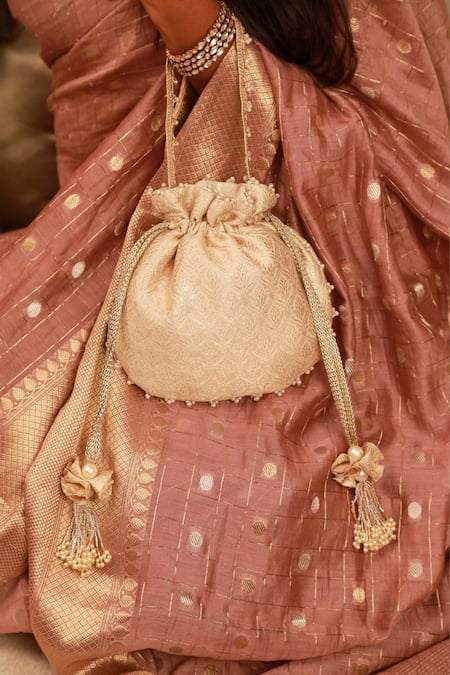 Shop Amyra Ivory Beads, Tassels Embroidered Brocade Potli Bag Online at Aza Fashions Shop_Amyra_Ivory Beads, Tassels Embroidered Brocade Potli Bag_Online_at_Aza_Fashions