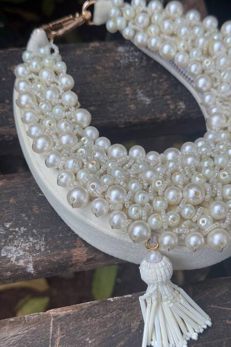 Bhavna Kumar White Pearls, Tassels Embellished Moon Mini Bag at Aza Fashions Bhavna Kumar_White Pearls, Tassels Embellished Moon Mini Bag_at_Aza_Fashions