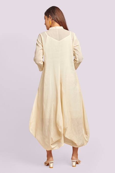 Shop Blue Lotus Design Ivory Cotton Embroidery Round Neck Drape Midi Dress at Aza Fashions Shop_Blue Lotus Design_Ivory Cotton Embroidery Round Neck Drape Midi Dress _at_Aza_Fashions