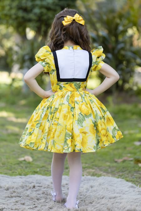 Shop The Pony & Peony Co. Yellow Cotton Bows Floral Peony Dress at Aza Fashions Shop_The Pony & Peony Co._Yellow Cotton Bows Floral Peony Dress _at_Aza_Fashions