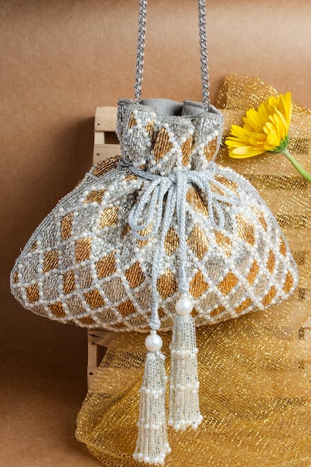 Shop Nayaab By Sonia Gold Pearls, Tassels Cruzado Silver Aurum Potli Bag at Aza Fashions Shop_Nayaab By Sonia_Gold Pearls, Tassels Cruzado Silver Aurum Potli Bag _at_Aza_Fashions