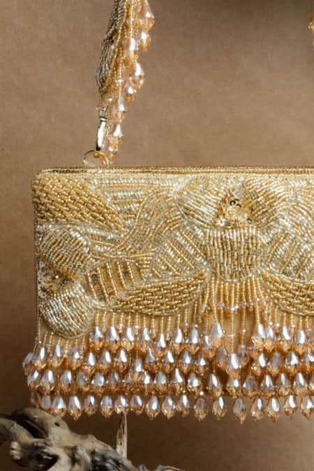 Nayaab By Sonia Gold Beads, Tassels Ornate Radiance Kasse Clutch Online at Aza Fashions Nayaab By Sonia_Gold Beads, Tassels Ornate Radiance Kasse Clutch _Online_at_Aza_Fashions