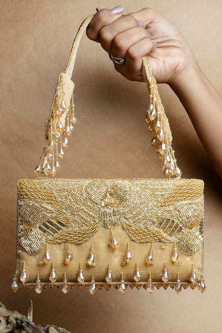 Shop Nayaab By Sonia Gold Beads, Tassels Ornate Radiance Kasse Clutch at Aza Fashions Shop_Nayaab By Sonia_Gold Beads, Tassels Ornate Radiance Kasse Clutch _at_Aza_Fashions