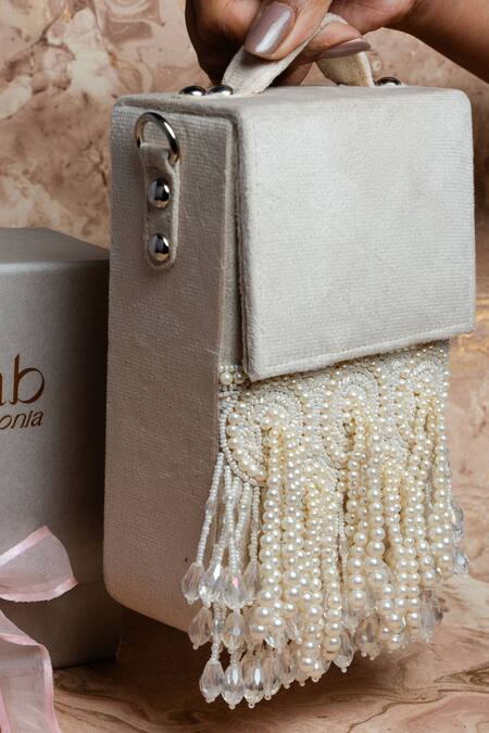 Buy Nayaab By Sonia Ivory Pearls, Crystals Tassel Potli Clutch Online at Aza Fashions Buy_Nayaab By Sonia_Ivory Pearls, Crystals Tassel Potli Clutch_Online_at_Aza_Fashions