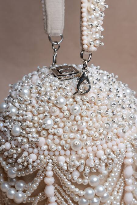 Nayaab By Sonia Off White Pearls, Tassels Oyster Overload Embellished Potli at Aza Fashions Nayaab By Sonia_Off White Pearls, Tassels Oyster Overload Embellished Potli _at_Aza_Fashions