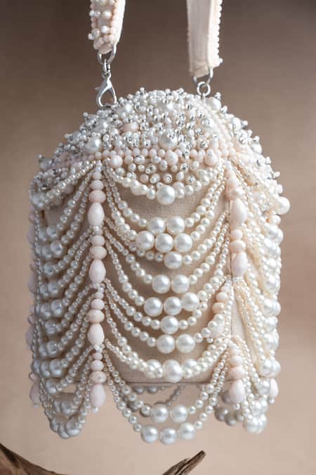 Shop Nayaab By Sonia Off White Pearls, Tassels Oyster Overload Embellished Potli at Aza Fashions Shop_Nayaab By Sonia_Off White Pearls, Tassels Oyster Overload Embellished Potli _at_Aza_Fashions