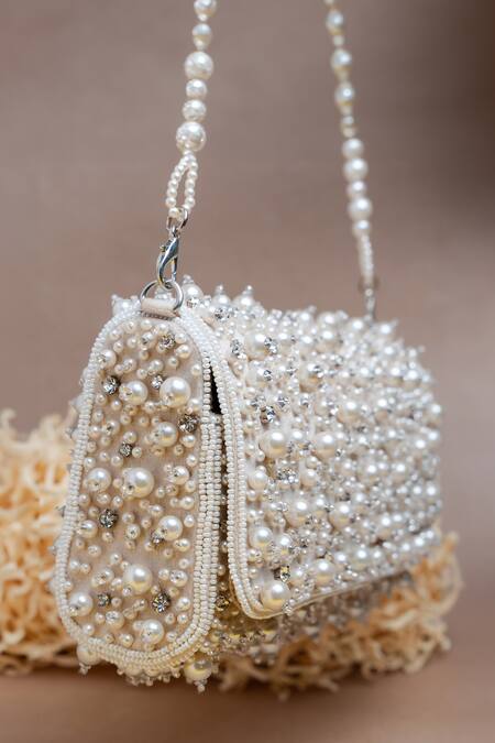 Nayaab By Sonia Ivory Pearls, Diamonds Cluster Clutch Online at Aza Fashions Nayaab By Sonia_Ivory Pearls, Diamonds Cluster Clutch _Online_at_Aza_Fashions