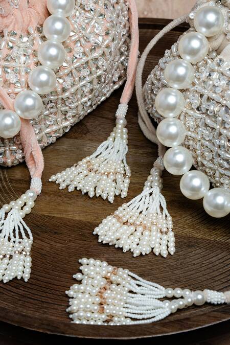 Nayaab By Sonia Ivory Embroidery, Beads, Pearls, Sequins Potli Bag With Handle at Aza Fashions Nayaab By Sonia_Ivory Embroidery, Beads, Pearls, Sequins Potli Bag With Handle _at_Aza_Fashions
