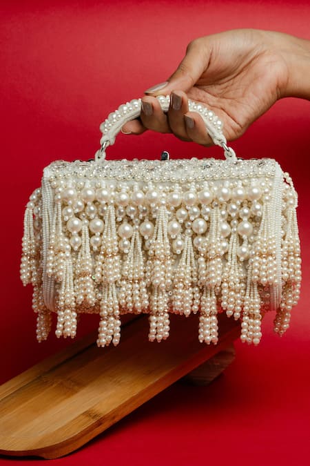 Shop Nayaab By Sonia White Pearls, Tassels Velvet Box Clutch at Aza Fashions Shop_Nayaab By Sonia_White Pearls, Tassels Velvet Box Clutch _at_Aza_Fashions