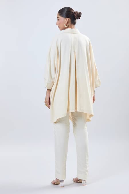 Shop Ott Ivory Cotton V-neck Asymmetrical Tunic With Belt at Aza Fashions Shop_Ott_Ivory Cotton V-neck Asymmetrical Tunic With Belt _at_Aza_Fashions