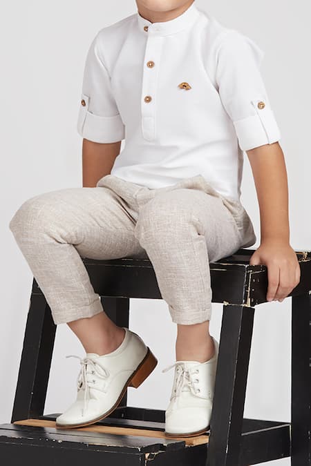 Petite Pomme White Cotton, Linen Boys Short Kurta Set With Beige Pants at Aza Fashions Petite Pomme_White Cotton, Linen Boys Short Kurta Set With Beige Pants _at_Aza_Fashions