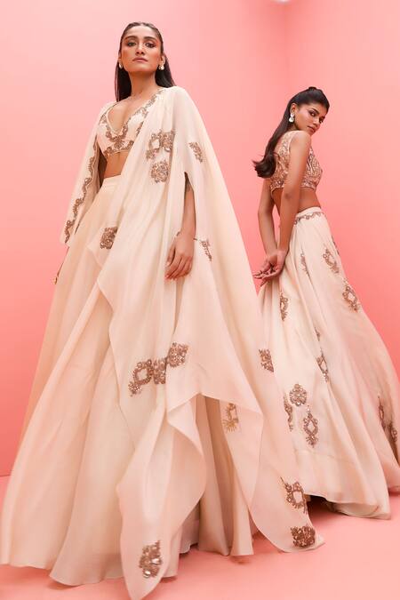 Vasavi Shah_Ivory Tissue Sequins, Embroidery V-neck Metallic Lehenga Set _at_Aza_Fashions