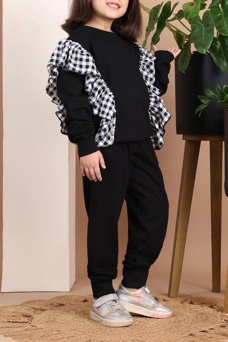 Petite Pomme Black Cotton Checkered Frilled Top And Jogger Set at Aza Fashions Petite Pomme_Black Cotton Checkered Frilled Top And Jogger Set _at_Aza_Fashions