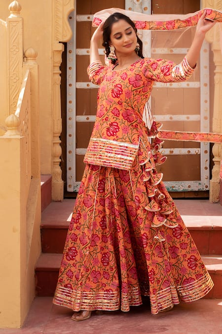 Shop_Pomcha Jaipur_Peach Cotton, Net Embroidery, Ruffles Round Neck Floral Kurta Set With Dupatta _Online_at_Aza_Fashions