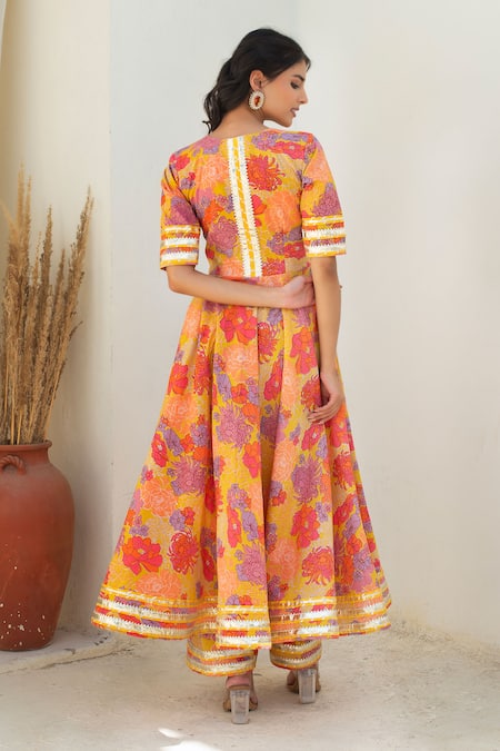 Shop Pomcha Jaipur Yellow Cotton, Net Tassels V-neck Floral Print Anarkali Kurta Set at Aza Fashions Shop_Pomcha Jaipur_Yellow Cotton, Net Tassels V-neck Floral Print Anarkali Kurta Set _at_Aza_Fashions