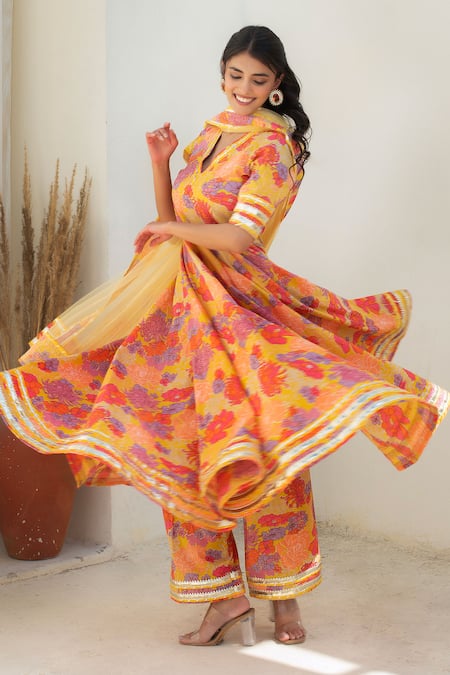 Shop Pomcha Jaipur Yellow Cotton, Net Tassels V-neck Floral Print Anarkali Kurta Set Online at Aza Fashions Shop_Pomcha Jaipur_Yellow Cotton, Net Tassels V-neck Floral Print Anarkali Kurta Set _Online_at_Aza_Fashions