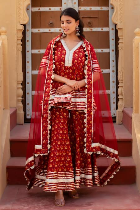 Shop Pomcha Jaipur Red Cotton, Net Embroidery, Pom-poms V-neck Printed Kurta Set With Sharara Online at Aza Fashions Shop_Pomcha Jaipur_Red Cotton, Net Embroidery, Pom-poms V-neck Printed Kurta Set With Sharara _Online_at_Aza_Fashions