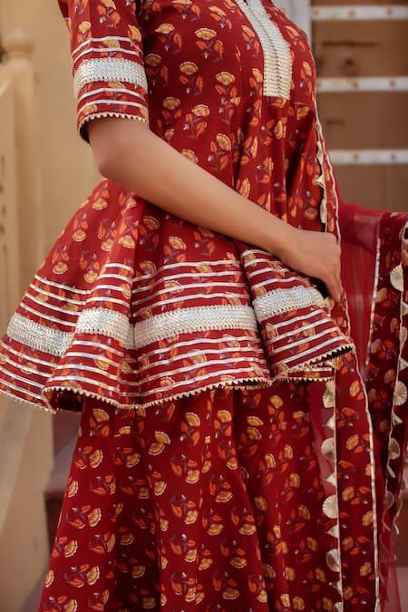 Pomcha Jaipur Red Cotton, Net Embroidery, Pom-poms V-neck Printed Kurta Set With Sharara at Aza Fashions Pomcha Jaipur_Red Cotton, Net Embroidery, Pom-poms V-neck Printed Kurta Set With Sharara _at_Aza_Fashions