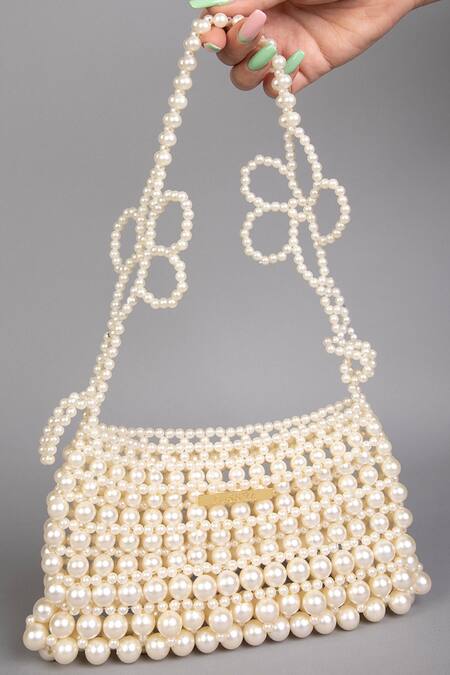 Buy_Tussya_White Pearls Curved Handbag With Detachable Sling_Online_at_Aza_Fashions