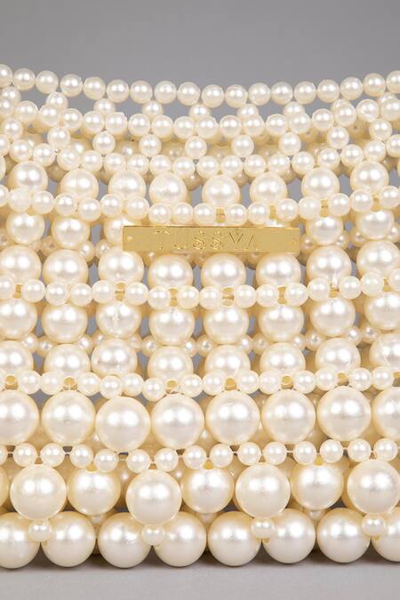 Shop_Tussya_White Pearls Curved Handbag With Detachable Sling_Online_at_Aza_Fashions