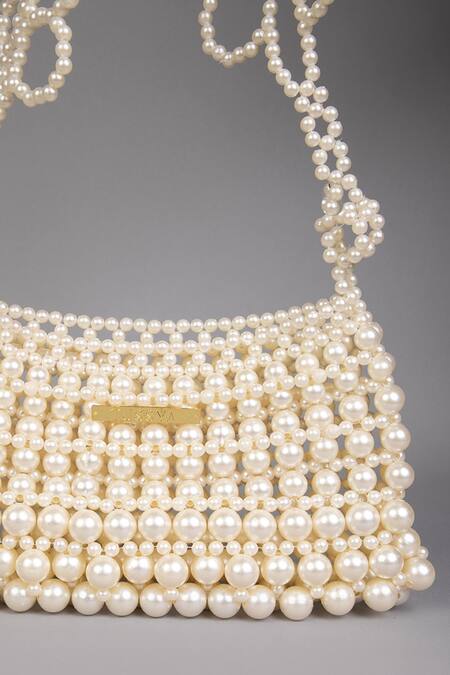 Tussya_White Pearls Curved Handbag With Detachable Sling_at_Aza_Fashions