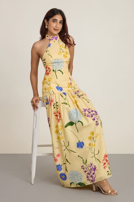 The Whole Nine Yards_Yellow Silk Halter Neck Floral Printed Maxi Dress _Online_at_Aza_Fashions
