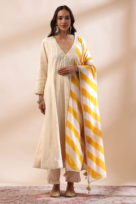 Shop Kyra By Bhavna Ivory Chanderi Silk, Cotton Embroidery, Lace Anarkali Set With Mustard Dupatta at Aza Fashions Shop_Kyra By Bhavna_Ivory Chanderi Silk, Cotton Embroidery, Lace Anarkali Set With Mustard Dupatta _at_Aza_Fashions