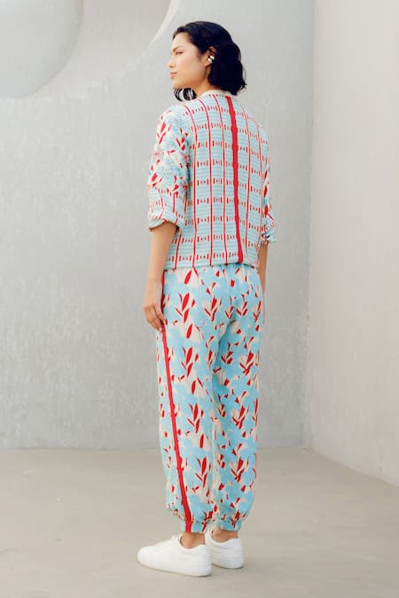 Shop Pooja Rajgarhia Gupta Blue Georgette Round Neck, Collared Floral Print Top And Track Pant Set at Aza Fashions Shop_Pooja Rajgarhia Gupta_Blue Georgette Round Neck, Collared Floral Print Top And Track Pant Set _at_Aza_Fashions