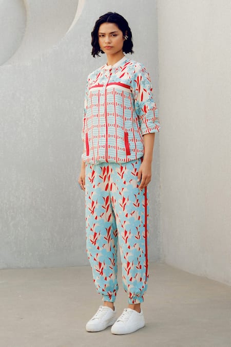 Shop Pooja Rajgarhia Gupta Blue Georgette Round Neck, Collared Floral Print Top And Track Pant Set Online at Aza Fashions Shop_Pooja Rajgarhia Gupta_Blue Georgette Round Neck, Collared Floral Print Top And Track Pant Set _Online_at_Aza_Fashions